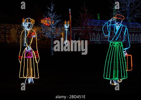 Man and woman dressed in traditional Japanese clothes made from glowing light bar Stock Photo