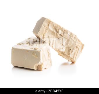 Fresh yeast blocks isolated on white background. Stock Photo