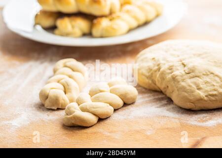 Unbaked braided bun dough. Raw dough. Unbaked buns. Stock Photo