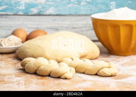 Unbaked braided bun dough. Raw dough. Unbaked buns. Stock Photo