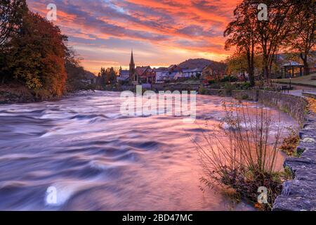 Sunrise over the town of Llangollen captured from the bank of the river Dee. Stock Photo