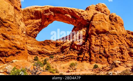 The South Window Arch in the Windows Section in the desert landscape of Arches National Park, Utah, United States Stock Photo