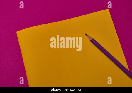 crayon at yellow and magenta background with copy space. Stock Photo