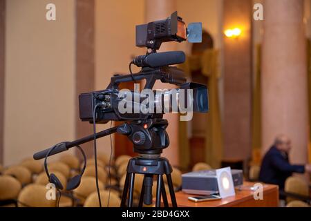 Professional production video camera. video camera set on a tripod with excellent clipping path . Stock Photo