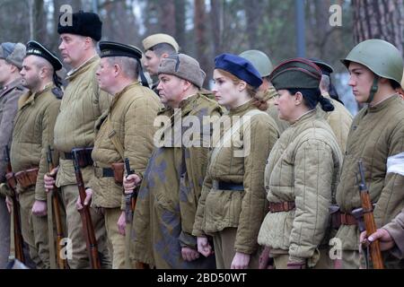 Vorzel, Ukraine - May 9, 2018: People in the form of Red Army soldiers stand in formation with weapons on the historical reconstruction of the anniver Stock Photo