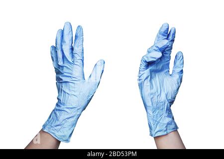 Two female hands in blue rubber medical gloves on white background isolated close up, doctor or nurse hands in latex protective gloves, disposable Stock Photo