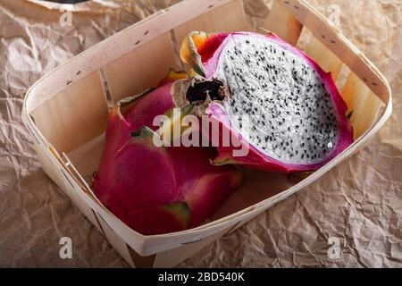 cut fresh pitahaya fruit in a basket Stock Photo