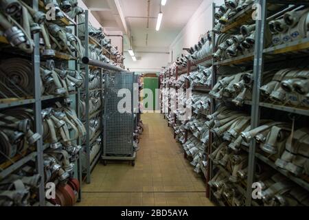 06 April 2020, Saxony-Anhalt, Arneburg: Fire hoses are stored in the fire brigade technical centre (FTZ) of the district of Stendal. New hoses are stored in the FTZ and old hoses are checked and washed. In the afternoon the converted hose washing facility of the FTZ was put into operation. The hose washing is basically the washing machine for fire hoses. The FTZ cleans and tests about 10.000 of these fire hoses per year. In the district of Stendal up to 16,000 hoses are in use by the fire brigades. Each hose has to be washed after each deployment. Photo: Klaus-Dietmar Gabbert/dpa-Zentralbild/Z Stock Photo