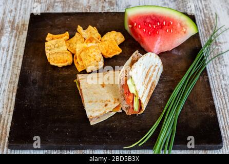 Vegetarian dish quesadilla de tuna tomato and avocado. Closeup. Stock Photo