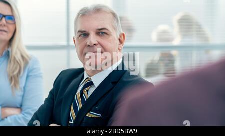 close up. thoughtful serious employees standing in the office Stock Photo