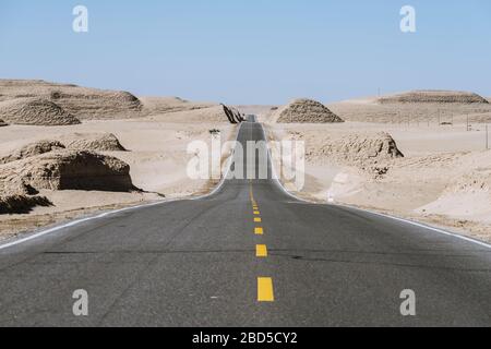 Gobi desert road on vast dry wilderness Stock Photo