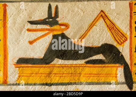 Thebes in Egypt, Valley of the Nobles (Dra Abu el Naga), tomb of Roy. A frieze on top of a wall, with Anubis tail overstepping the painted register. Stock Photo