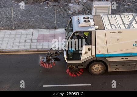 Street sweeper machine making it's way along our road, Playa San Juan, Tenerife, Canary Islands, Spain Stock Photo