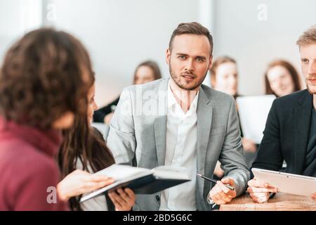 close up. brooding entrepreneur sitting at office Desk Stock Photo