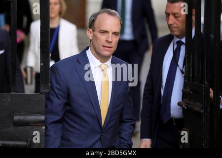 London, UK. 07th Apr, 2020. British Foreign Secretary Dominic Raab (C) arrives at 10 Downing street for the COVID-19 committee meeting in London, Britain, April 7, 2020. British Prime Minister Boris Johnson was taken to intensive care on Monday night after his coronavirus symptoms worsened, Downing Street said.    Johnson has asked British Foreign Secretary Dominic Raab to deputize for him, a Downing Street spokesman said. Credit: Xinhua/Alamy Live News Stock Photo