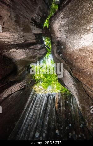 Vertical view of the Tukad Cepung waterfalls in Bali, Indonesia. Stock Photo