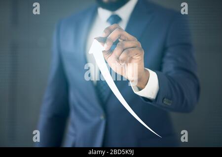 Businessman Holding Stylus Drawing Arrow Going Up On Virtual Panel Stock Photo