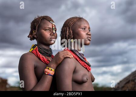 An unmarried woman, left, and married woman, right, member of the Dassanetch ethnic group or tribe, Omorate, southern Ethiopia. Stock Photo