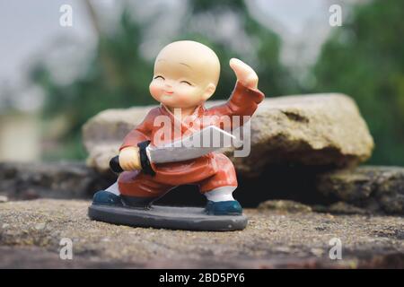 Cute superman superhero batman superman fantasy toy doll. Robotic alien fictional character adventure background. Part of series. Close up portrait. Stock Photo
