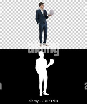 Very excited elegant man in suit standing with laptop in hands S Stock Photo
