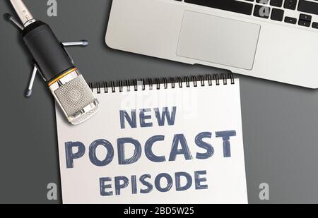 top view of podcast recording equipment on desk with words new podcast episode written on note pad Stock Photo