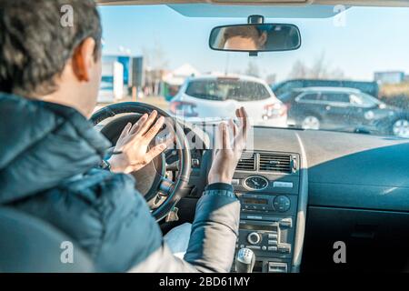 angry man, uses the car horn Stock Photo