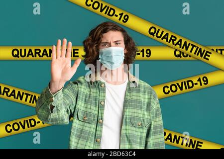 COVID-19 outburst. Teenager wearing medical mask and making STOP gesture. Collage with QUARANTINE yellow tape Stock Photo