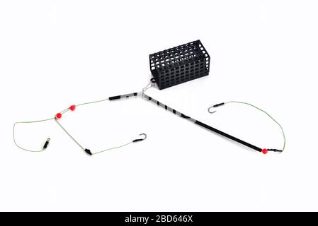 fishing trough, fishing hooks and fishing line, accessories for bottom  fishing on a white background close-up Stock Photo - Alamy