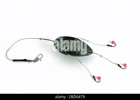 fishing trough spoon, fishing hooks and fishing line, accessories for bottom  fishing on a white background close-up Stock Photo - Alamy