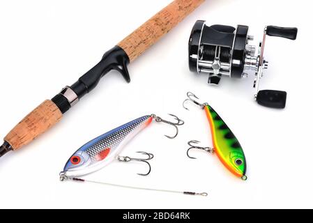 Spinning rod with baitcasting reel, bait and caught a pike lying on the  snow in the winter Stock Photo - Alamy