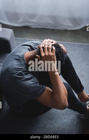 frustrated african american man having panic attack at home Stock Photo