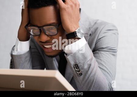 stressed african american speaker having panic attack on business conference in office Stock Photo