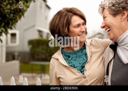A mother and daughter laughing together. Stock Photo