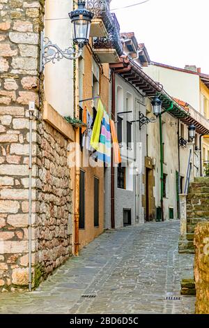 Houses along a cobbled street in the medieval town centre of Zumaia, Gipuzkoa, Basque Country, north Spain. February 2017. Stock Photo