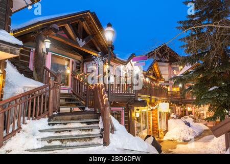 Breckenridge, Colorado, USA downtown streets at night in the winter with holiday lighting. Stock Photo