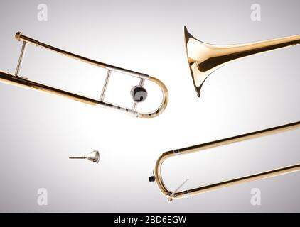 Trombone disassembled with white gradient isolated background. Side view. Horizontal composition. Stock Photo