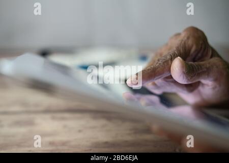 Close up of senior women hand use digital tablet. Stock Photo