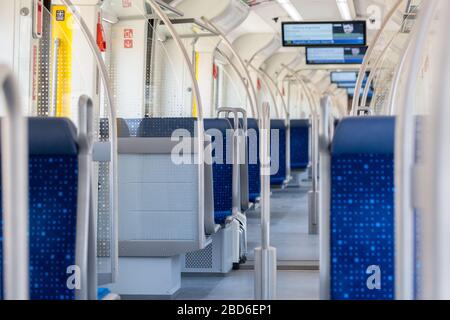 Interior of an empty Munich public transport train (S-Bahn / S Bahn). Due to Covid-19 the usage of public transport in Germany dropped by 80 to 90%. Stock Photo