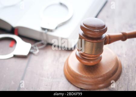 Close up of gavel and open book on table  Stock Photo