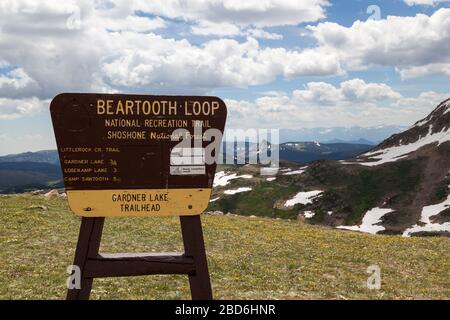 Shoshone National Forest, Wyoming, USA - July 13, 2014:  A wooden sign for Beartooth Loop recreation trail and Garedner Lake trailhead in Shoshone Nat