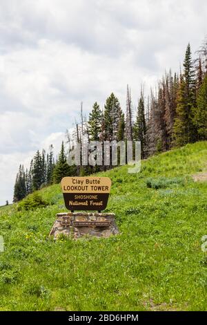 Shoshone National Forest, Wyoming, USA - July 13, 2014:  A wooden sign for Clay Butte Lookout Tower in Shoshone National Forest, Wyoming on July 13, 2