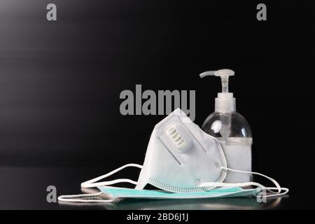Sanitizer gel or antibacterial soap and face mask for Covid-19 coronavirus preventive Stock Photo