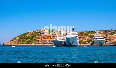 Porto Cervo, Sardinia / Italy - 2019/07/20: Panoramic view of luxury yacht port, marina and residences of Porto Cervo resort at the Costa Smeralda Stock Photo