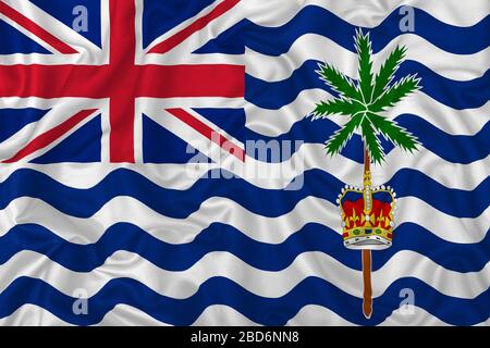British Indian Ocean Territory flag on wavy silk textile fabric background. Stock Photo