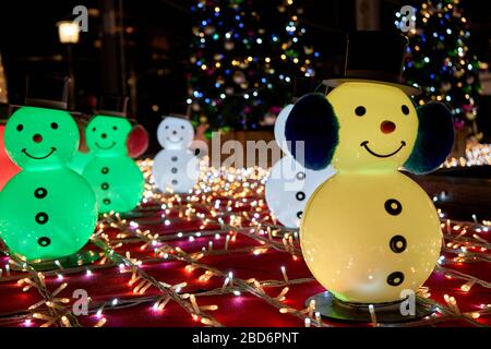 Snowmans and Christmas tree with various decorations Stock Photo