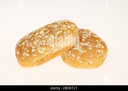 Two wholemeal bread rolls isolated against white Stock Photo