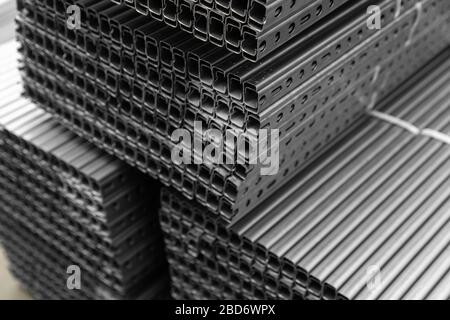high quality Galvanized steel profile or Aluminum and chrome stainless profiles in stack waiting for shipment Stock Photo