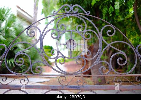 Forged steel gate with flower and floral graphic elements. Stock Photo