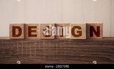 Desing Word on Wooden Cubes. Branding redesign rebranding marketing concept Stock Photo