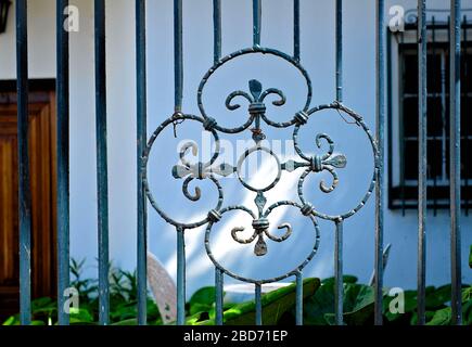 Wrought iron ornamental floral pattern, design of an old villa fence. Stock Photo